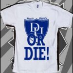 A white shirt with blue lettering on it.